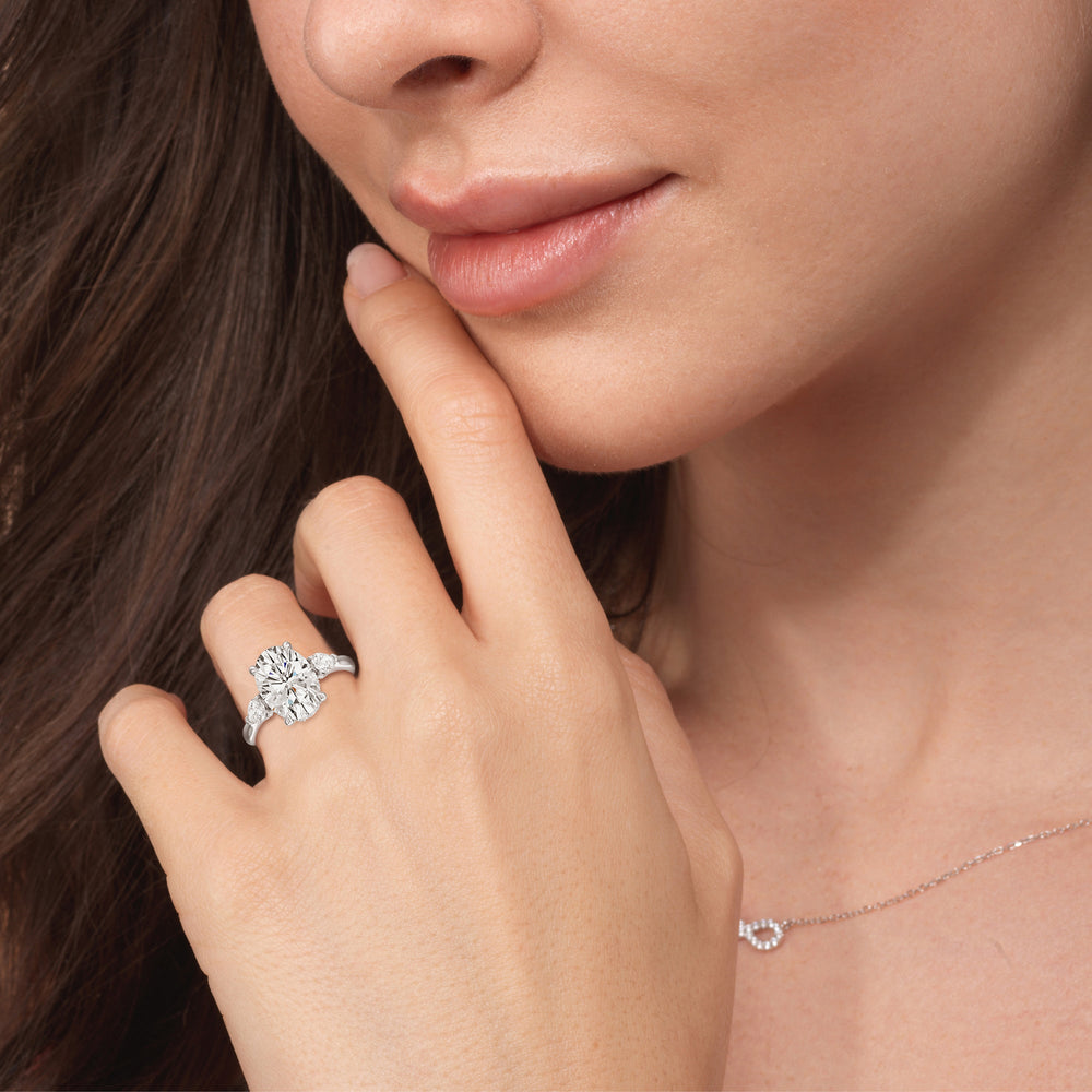 Model Wearing Elegance Pear Side Stone Engagement Ring with Lab Grown Diamond view