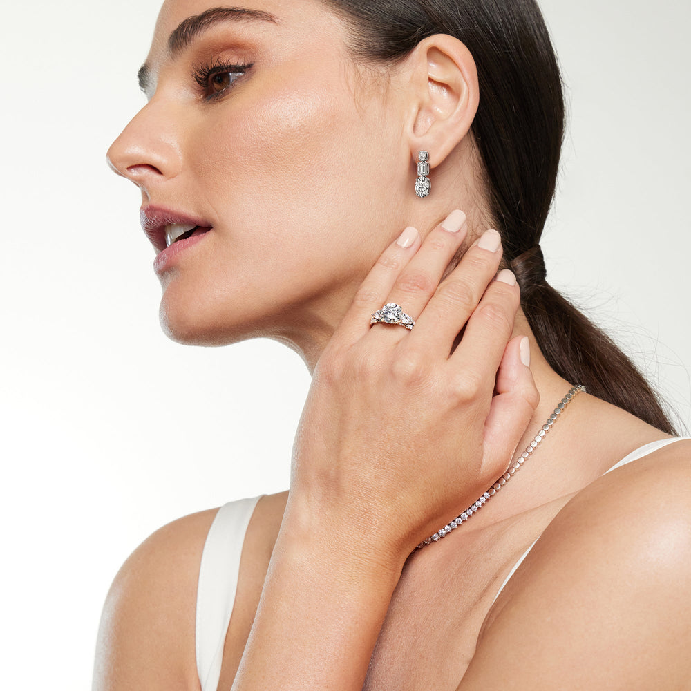 Model Wearing Elegance Oval and Emerald Dangle Earrings view