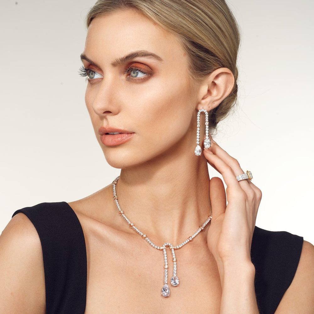 Model Wearing Balanced Oval and Pear Dangler Tennis Necklace view