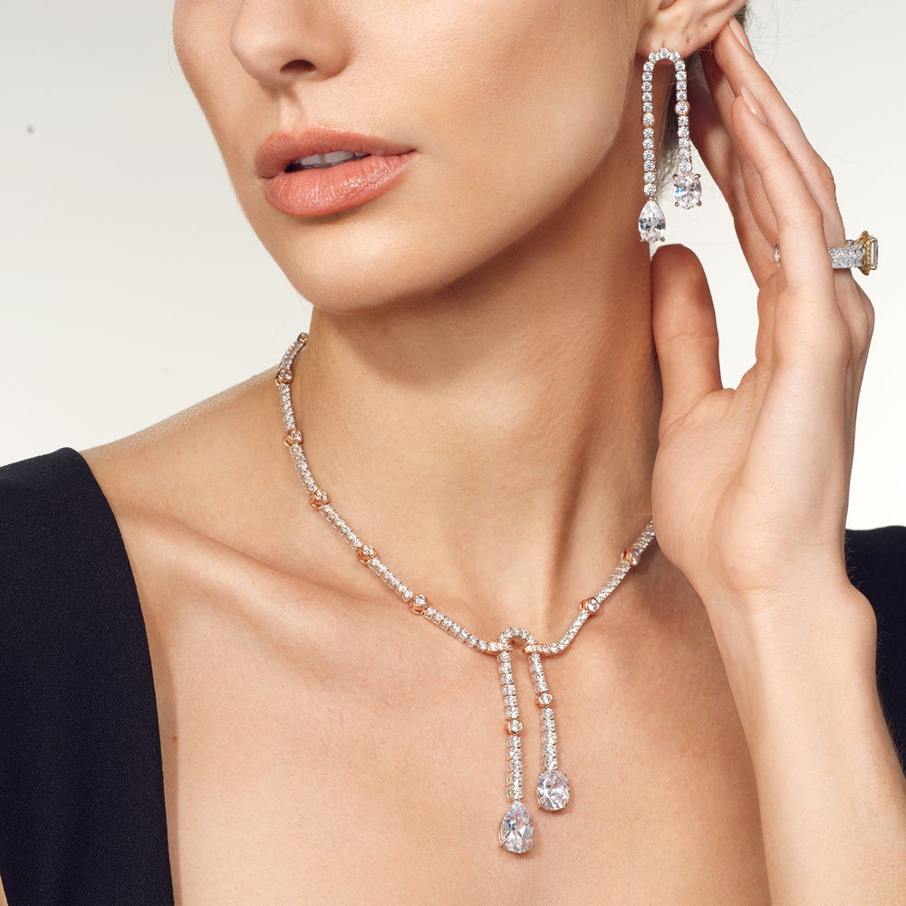 Model Wearing Balanced Oval and Pear Dangler Tennis Necklace view