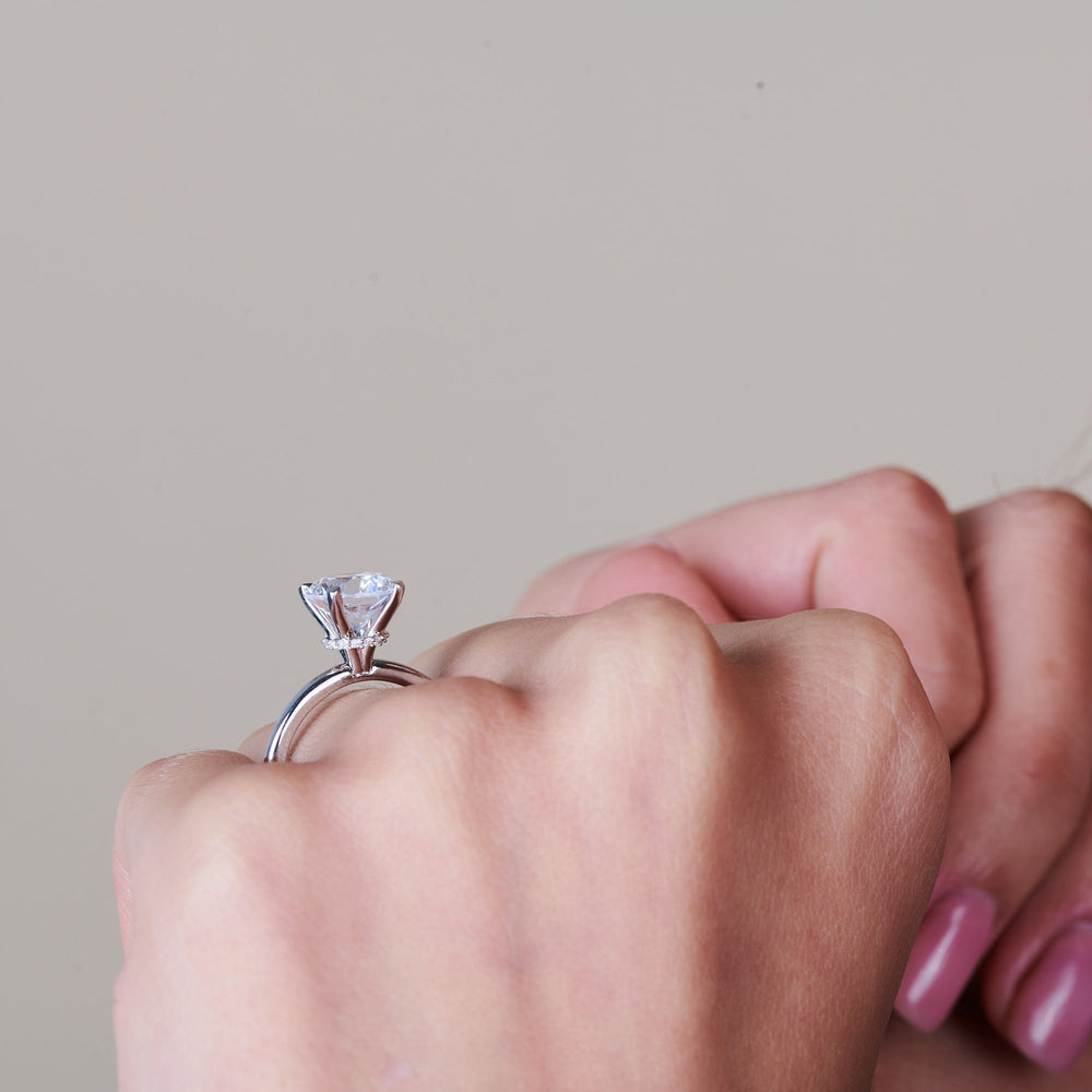 Model Wearing Modern Fine Line Hidden Halo Engagement Ring with Lab Grown Diamond view