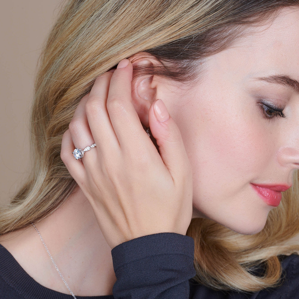 Model Wearing Petal Hidden Halo Engagement Ring with Lab Grown Diamond view